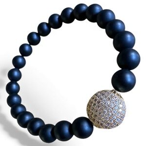 Matte 8mm Onyx Stretch Bracelet with Gold Pave Coin Shaped Crystal Spacer